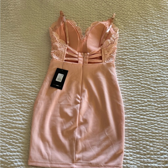 Fashion Nova peach coloured mini dress. - Picture 2 of 3